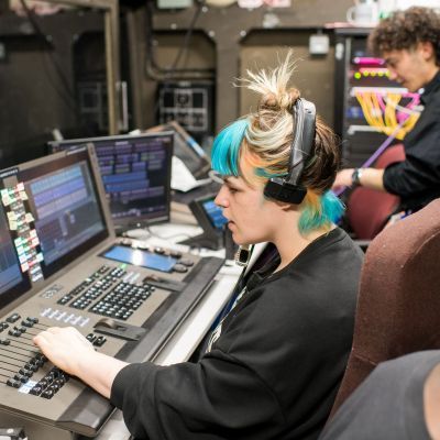 Production Arts student at a lighting desk